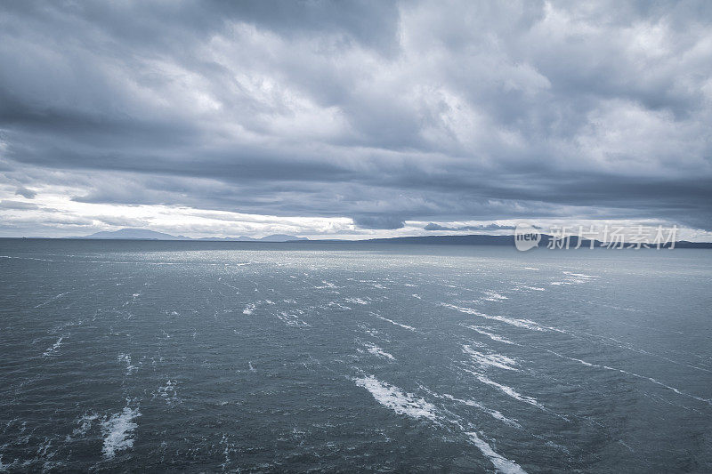 Moody Cloudscape Over The Ocean